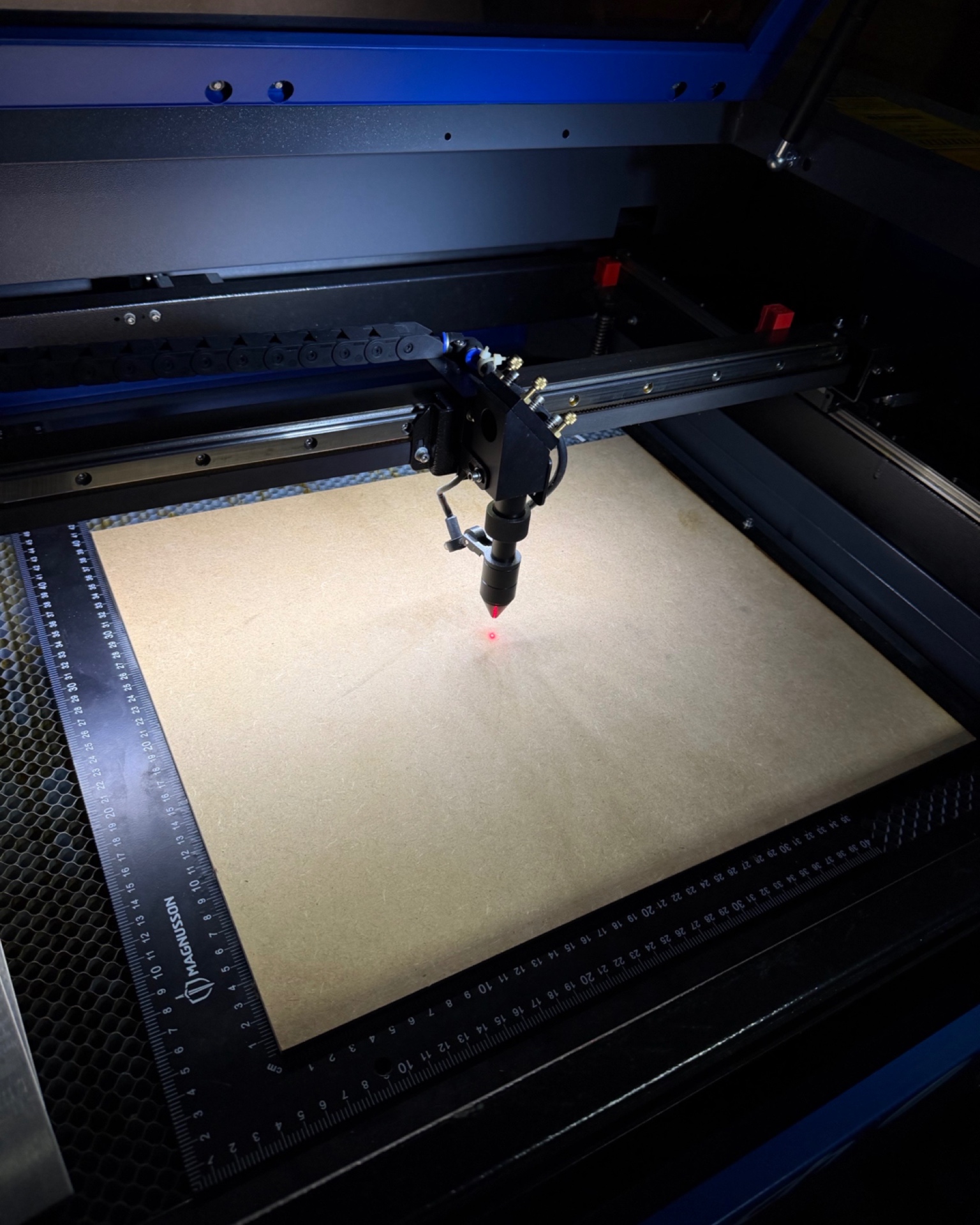 Laser engraver in our Dublin workshop preparing a wood panel